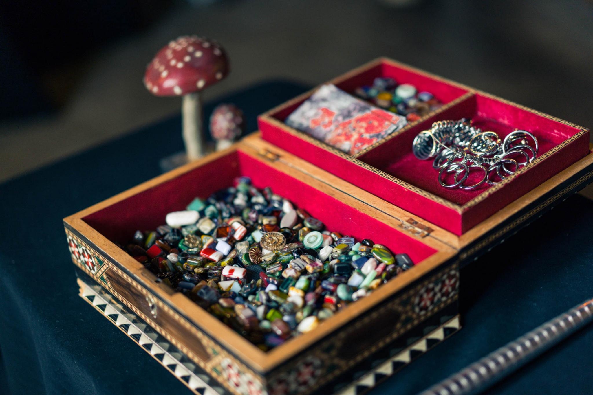 Antique box with glass beads and rings