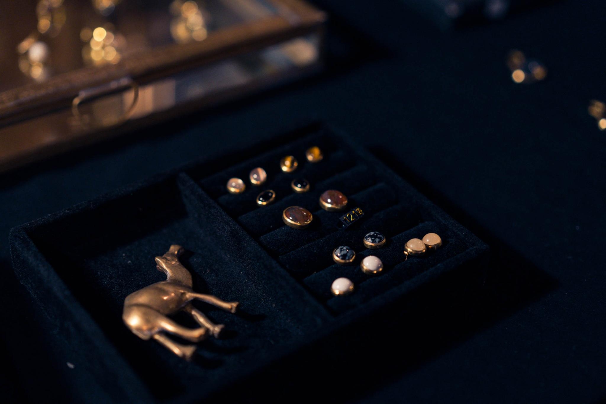 Stud earring tray with a small brass camel