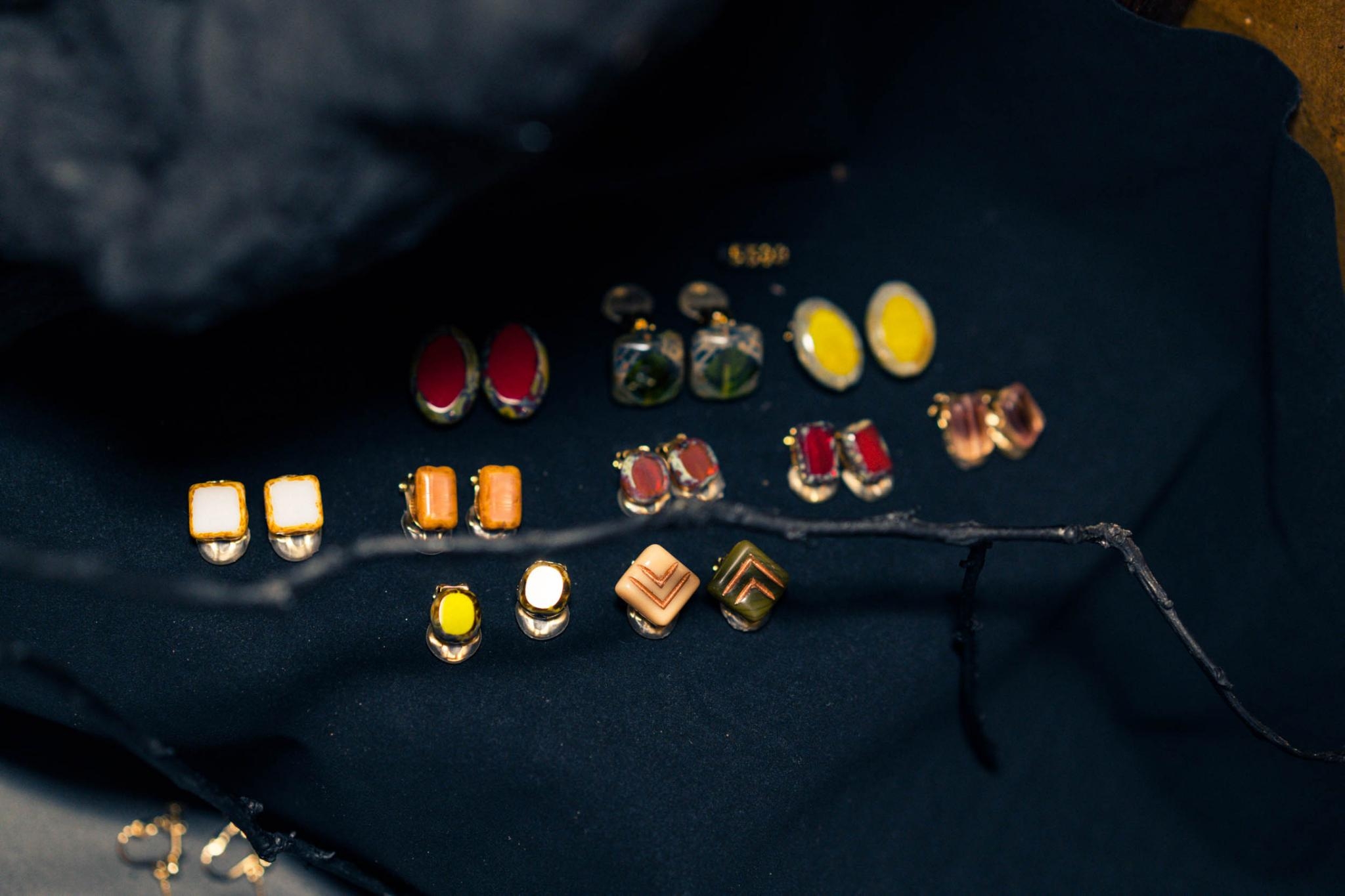 Vintage glass earrings on dark fabric