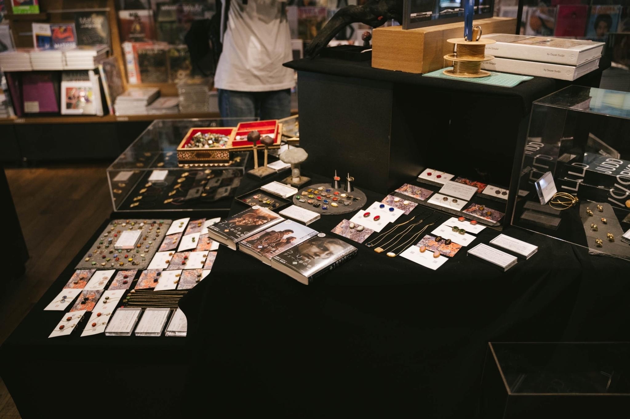 Jewelry spread with curated books